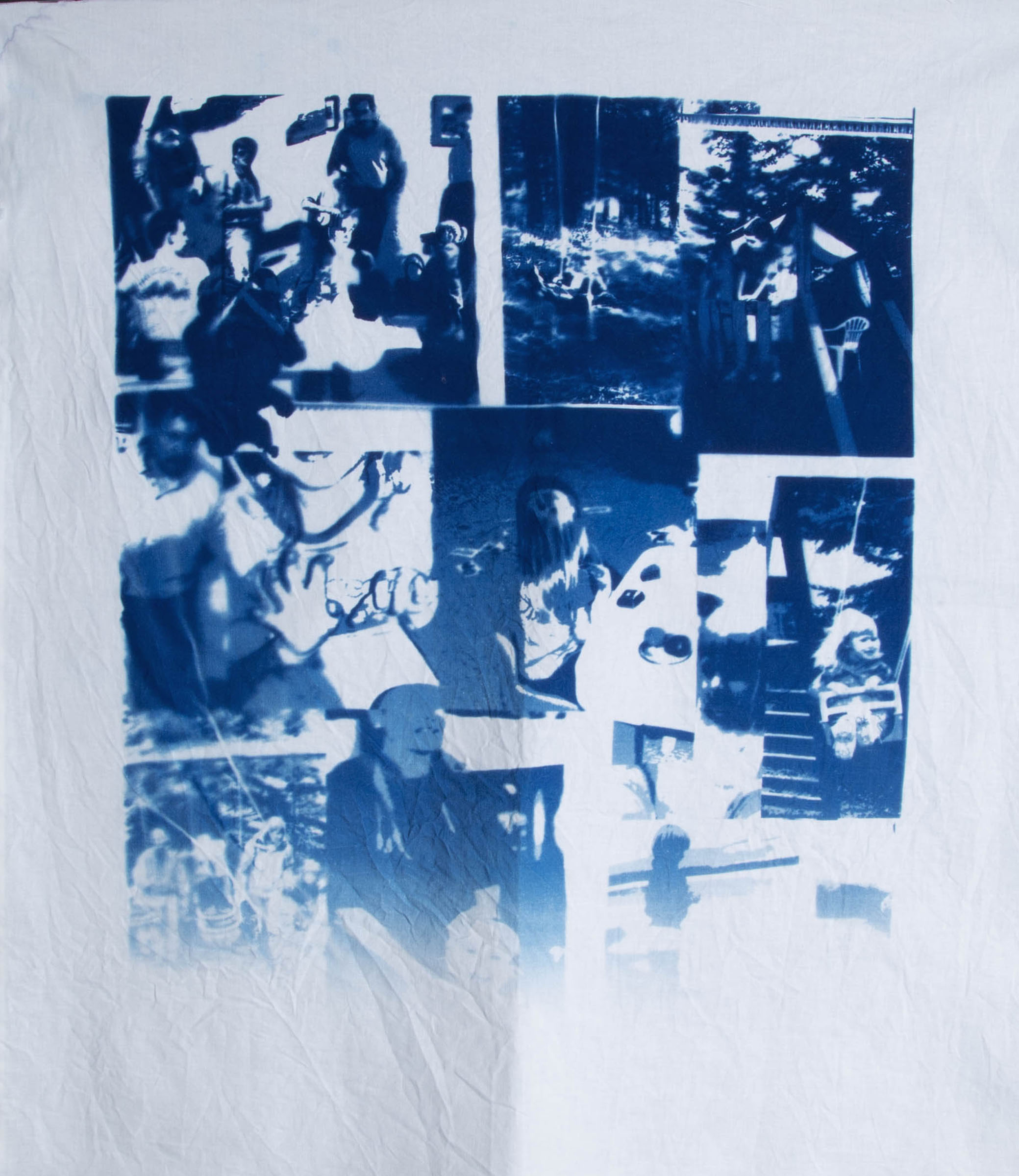 Blue cyanotype print on fabric of collaged childhood images